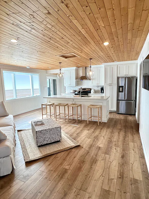 Bright living room of the Tiki lakefront cottage in Turkey Point, Ontario