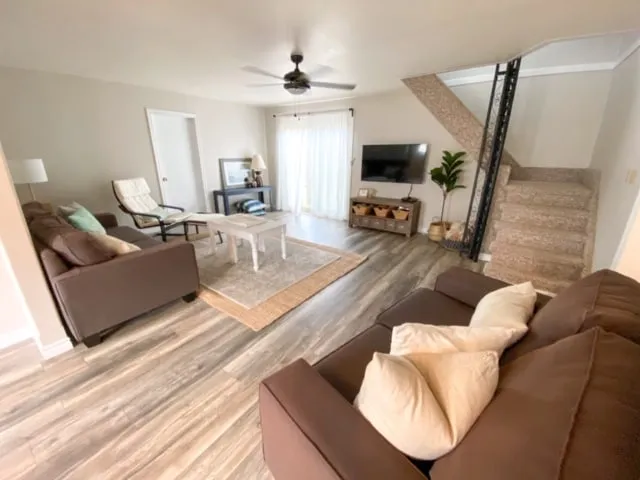 Living room with sofas and TV at Harold cottage