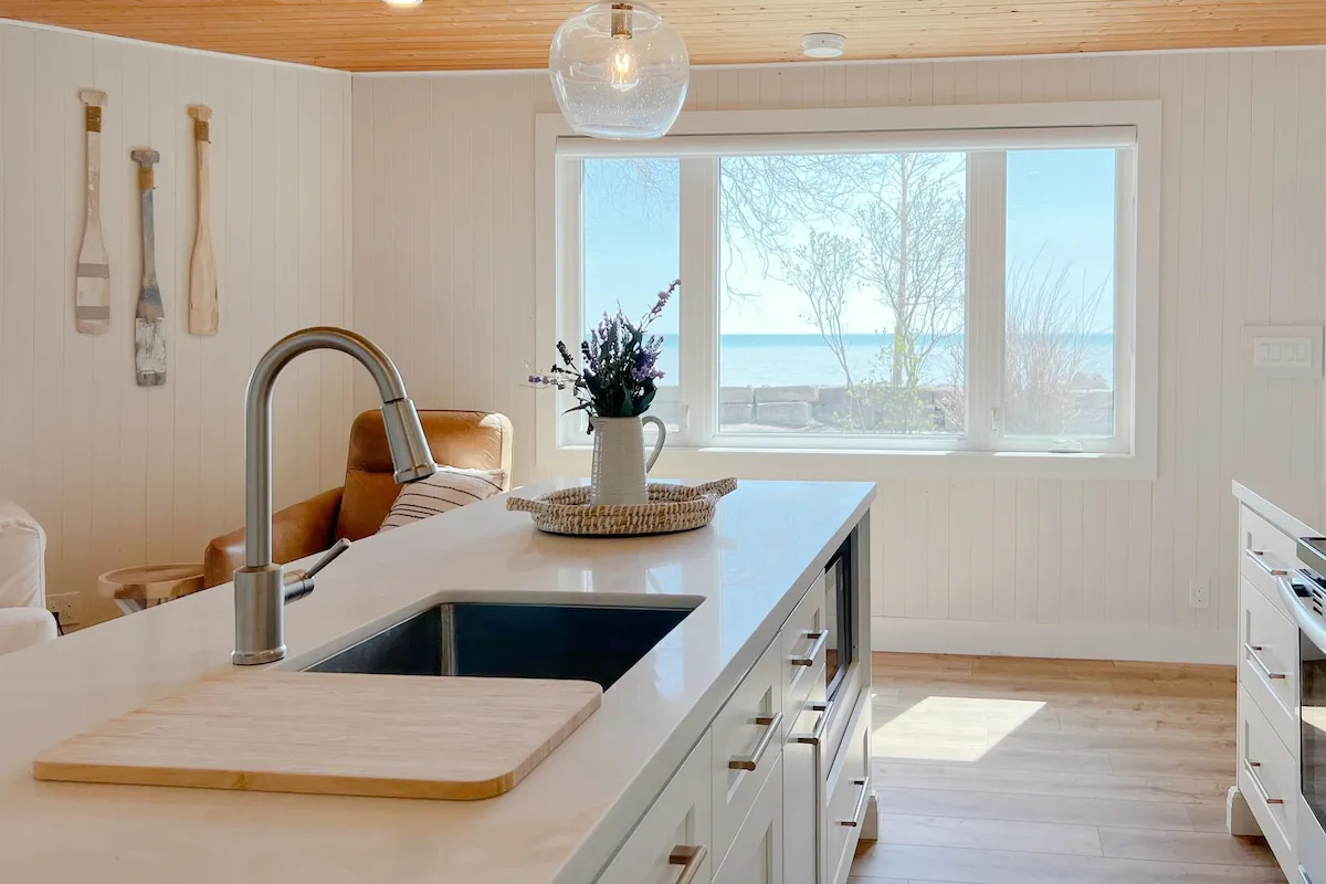 Kitchen sink with a view of Lake Erie at Tiki cottage